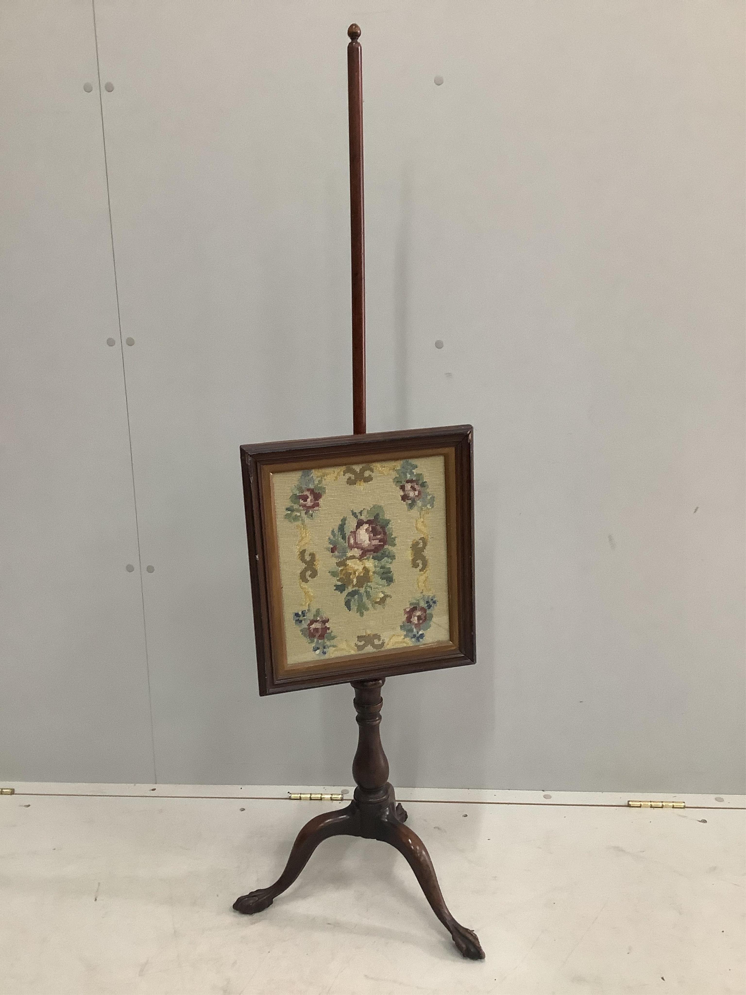 An Edwardian mahogany pole screen, height 134cm. Condition - good